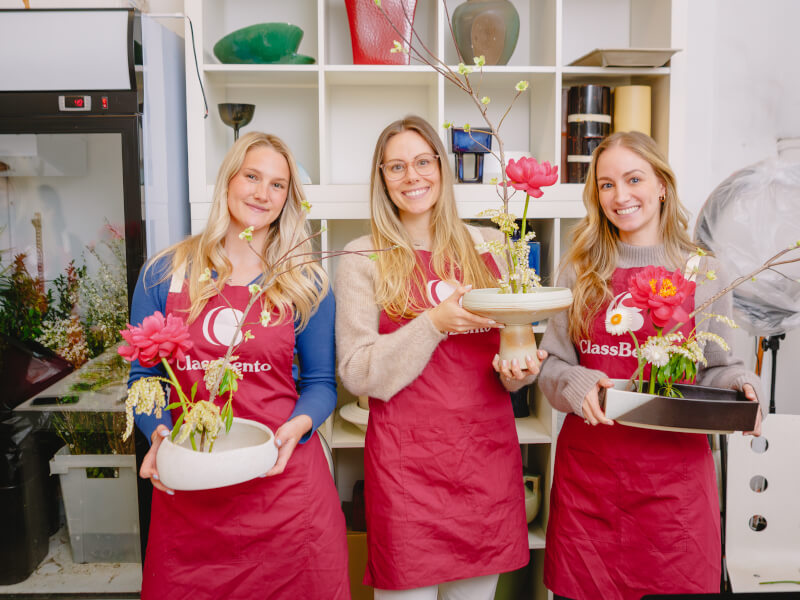 Women showing off their DIY Ikebana arrangements